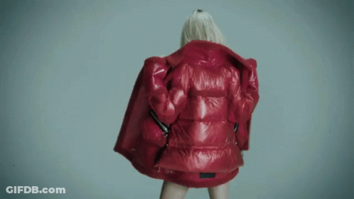 Woman In Red Jacket With Moncler On Back GIF