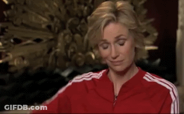 Woman In Red Jacket With White Stripes Smiling GIF