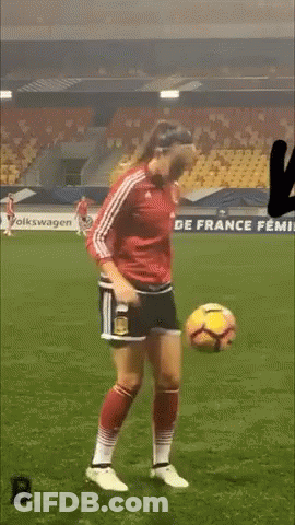 Woman In Red Jersey Kicking Soccer Ball GIF