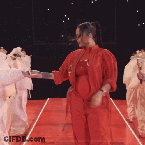 Woman In Red Jumpsuit Dancing GIF