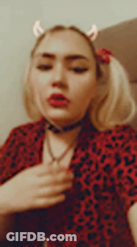 Woman In Red Leopard Shirt Removing Shirt GIF