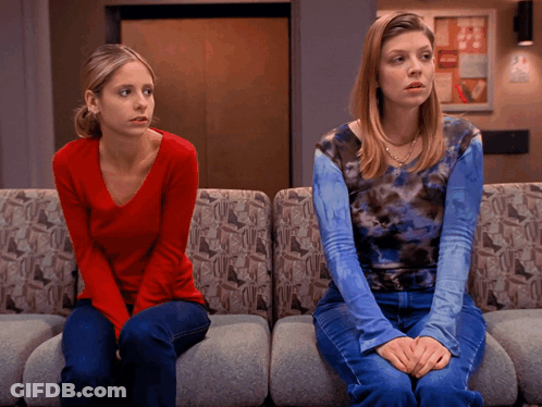 Woman In Red Next To Woman In Blue Tie Dye GIF