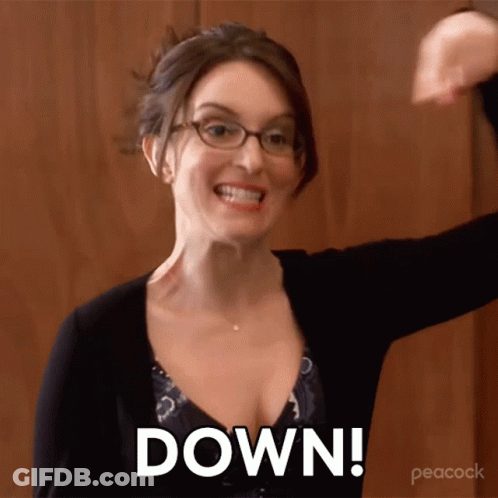 Woman In Red Plaid Shirt Hugging Man In Red Uniform GIF