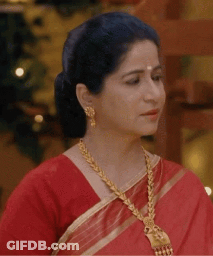 Woman In Red Saree Gold Jewelry Looking Side GIF