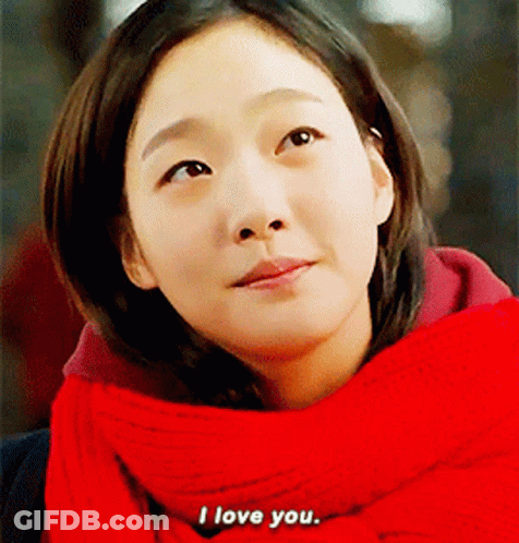 Woman In Red Scarf And Sweater Says I Love You GIF