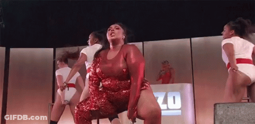 Woman In Red Sequined Dress Dancing Zo Sign GIF