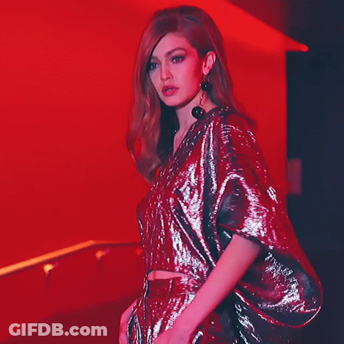 Woman In Red Sequined Top And Skirt GIF