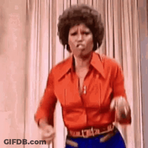 Woman In Red Shirt And Blue Jeans Dancing GIF