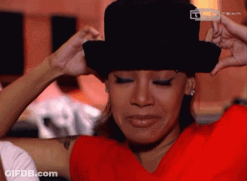 Woman In Red Shirt And Top Hat Saying Team GIF