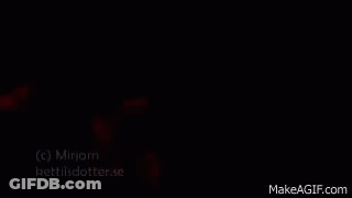 Woman In Red Shirt At Microphone GIF