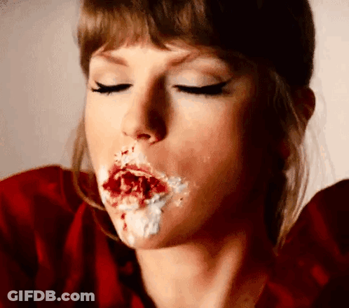Woman In Red Shirt Eating Cake, Frosted Mouth GIF