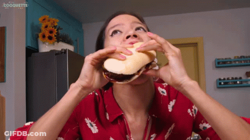 Woman In Red Shirt Eating Sandwich Coquette GIF