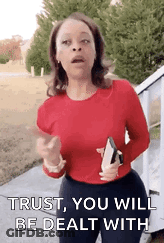 Woman In Red Shirt Holding Bible Pointing Saying Trust You Will Be Dealt With GIF
