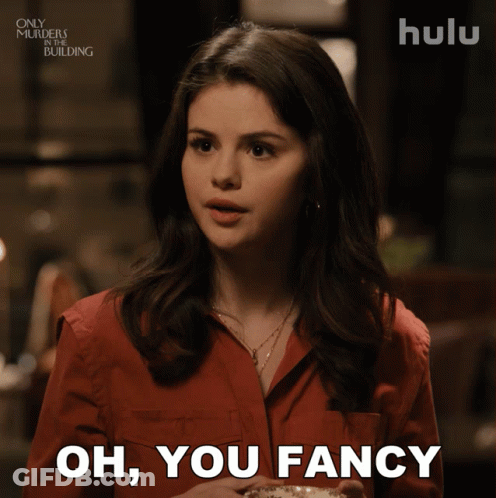 Woman In Red Shirt Holding Coffee Saying Oh You Fancy GIF