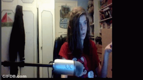 Woman In Red Shirt Holding Microphone GIF