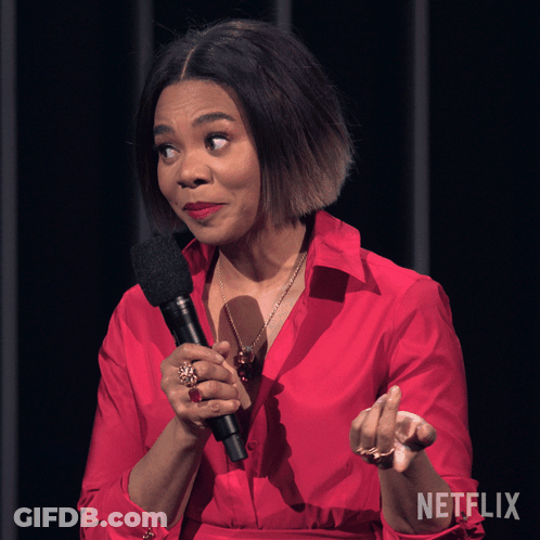 Woman In Red Shirt Holding Microphone Netflix Logo GIF
