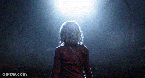 Woman In Red Shirt In Dark Room GIF