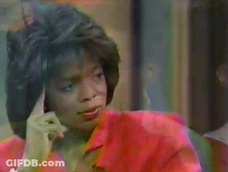 Woman In Red Shirt Making Finger Gesture GIF