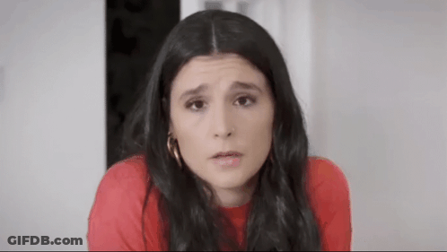 Woman In Red Shirt Making Funny Face GIF