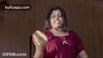 Woman In Red Shirt Making Funny Face Holding Bottle GIF