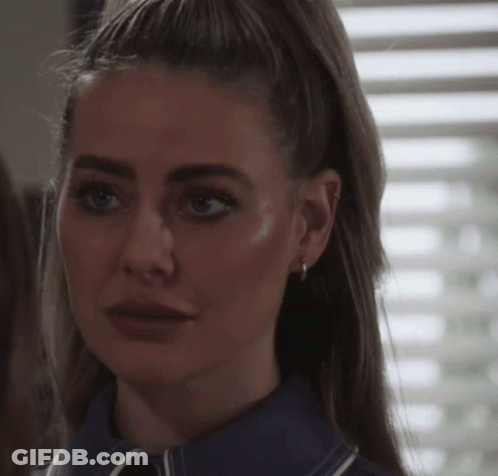 Woman In Red Shirt Making Silly Face GIF