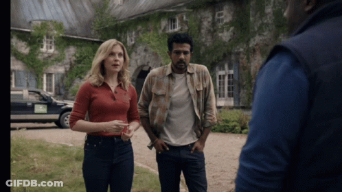 Woman In Red Shirt Next To Men In Plaid And Blue Vest GIF