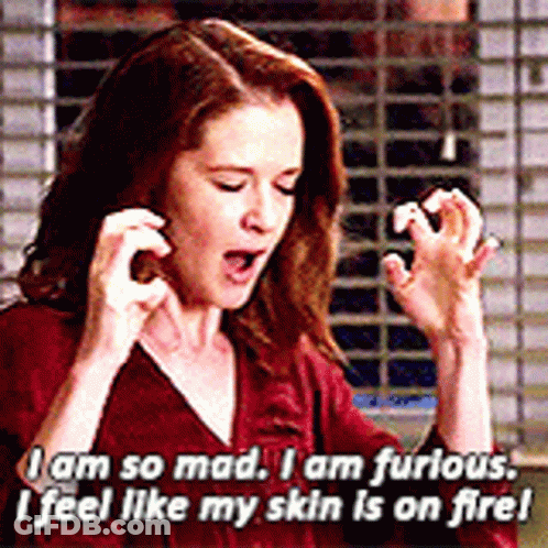 Woman In Red Shirt Saying I Am So Mad I Am Furious I Feel Like My Skin Is On Fire GIF