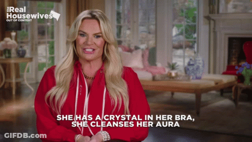 Woman In Red Shirt Says Crystal In Bra Cleanses Aura GIF
