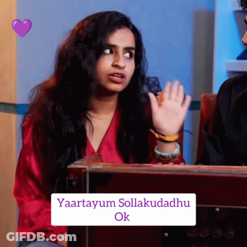 Woman In Red Shirt Sitting In Front Of Box Saying Yaartayum Sollakudadhu Ok GIF