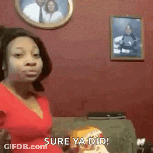 Woman In Red Shirt Sitting On Couch In Front Of Couple Picture GIF