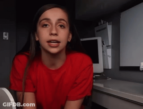 Woman In Red Shirt Sitting On Toilet GIF
