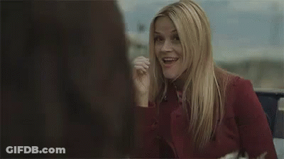 Woman In Red Shirt Smiling And Talking In Car GIF