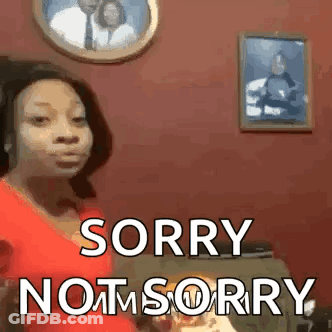 Woman In Red Shirt Standing Before Wall With Couple Picture GIF