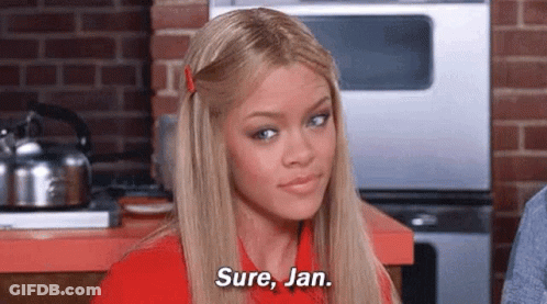 Woman In Red Shirt Talking In Kitchen GIF