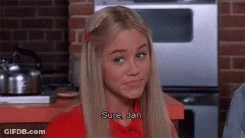 Woman In Red Shirt Talking In Kitchen GIF