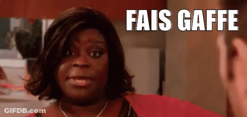 Woman In Red Shirt Talking To Man In Kitchen Fais Gaffe GIF