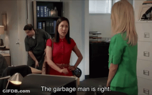 Woman In Red Shirt Talking To Woman In Green Suit Saying Garbage Man Is Right GIF