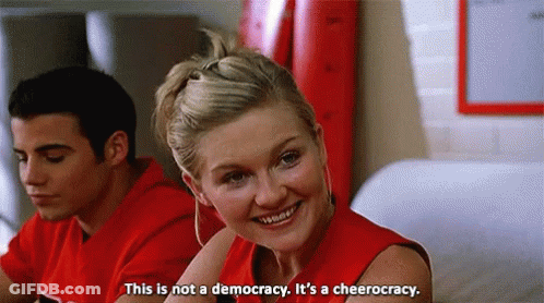 Woman In Red Shirt This Is Not A Democracy It's A Cheerleading GIF