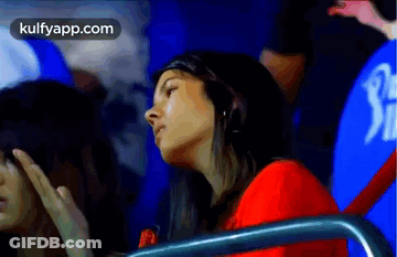 Woman In Red Shirt Watching Cricket GIF