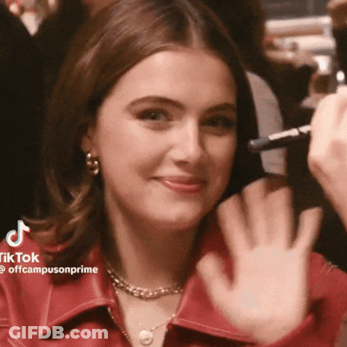 Woman In Red Shirt Waving GIF