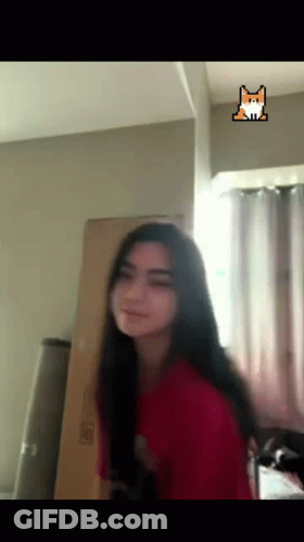 Woman In Red Shirt With Fox Sticker On Ceiling GIF