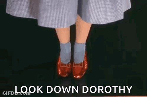 Woman In Red Shoes And Blue Socks Says Look Down Dorothy GIF