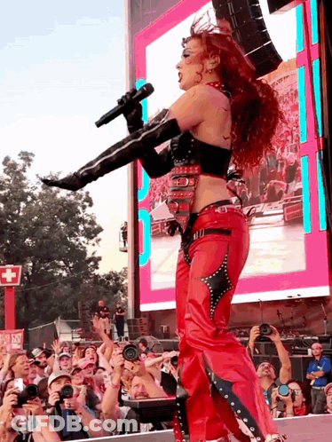 Woman In Red Singing Into Microphone GIF