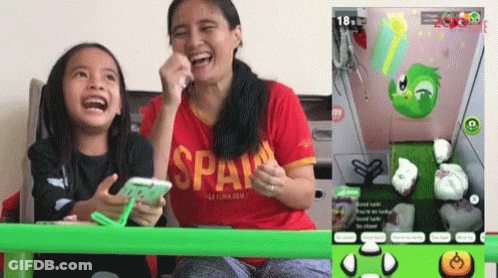 Woman In Red Span Shirt Laughing With Girl GIF