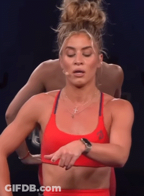 Woman In Red Sports Bra Pointing At Chest GIF