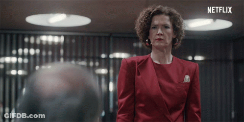 Woman In Red Suit At Netflix Sign GIF