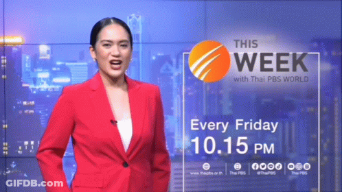 Woman In Red Suit In Front Of This Week Wall GIF