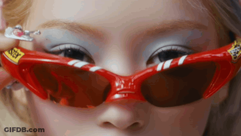 Woman In Red Sunglasses Saying Sticky GIF