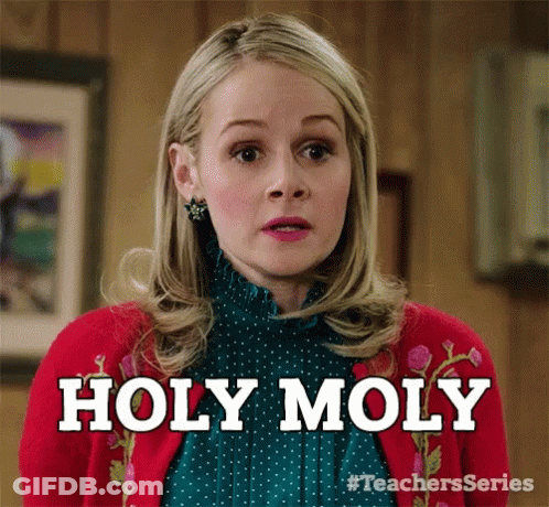 Woman In Red Sweater And Green Shirt Says Holy Moly GIF