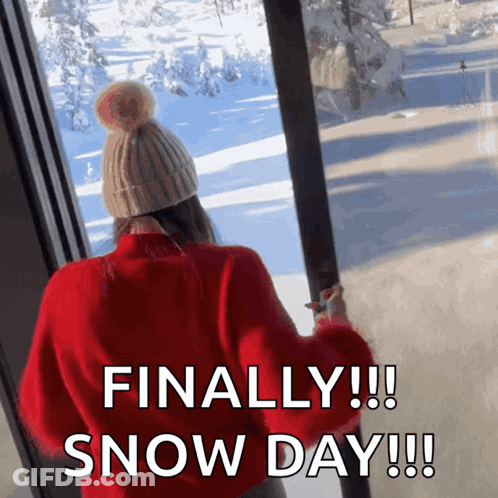 Woman In Red Sweater And Hat Looks Out Window GIF